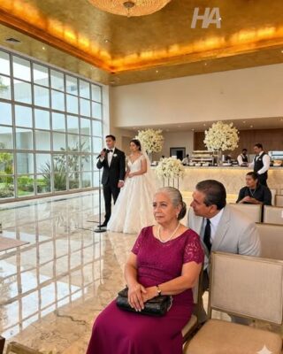 THEY HID YOU IN ROW 14 AT YOUR SON’S WEDDING… THEN THE MAN IN THE BLACK SUIT SAT BESIDE YOU, WHISPERED FOUR WORDS, AND YOUR SON TURNED GHOST-PALE